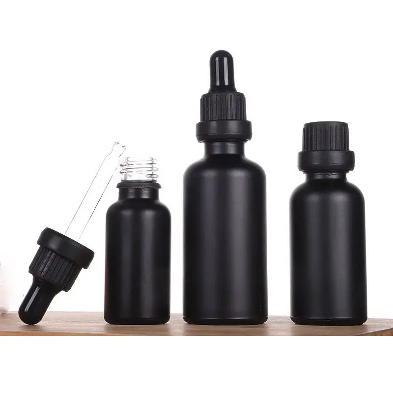 ODM / OEM 3ml 5ml 10ml 15ml 20ml 30ml 50ml 100ml Glasflasche aus ätherischem Öl aus schwarzem Glas mit Kunststoff tropfer und Pipetten