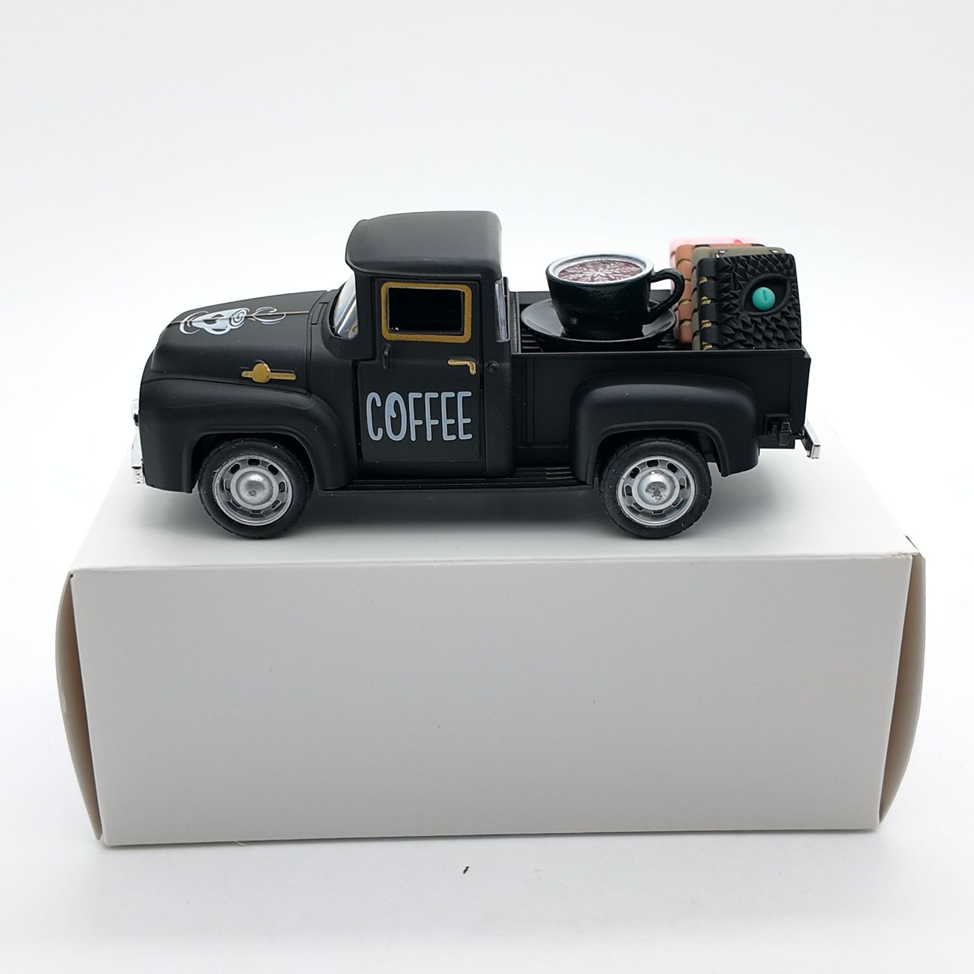 Camión negro+1 juego de café+4 libros