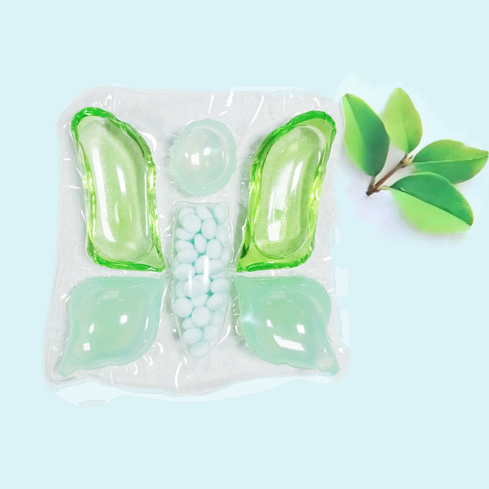 10 gramos de perlas de detergente para ropa con forma de mariposa verde.