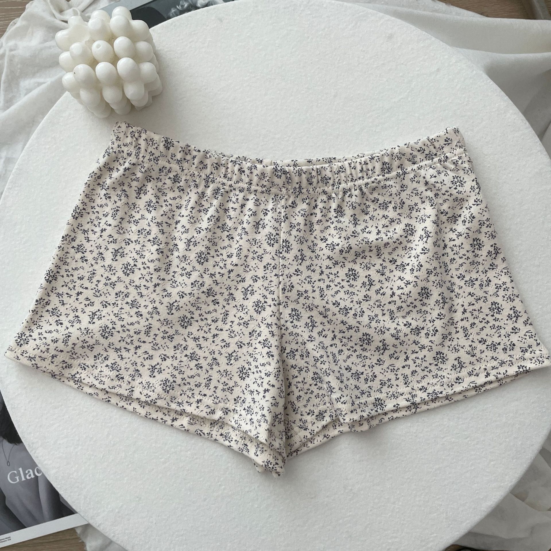 Fondo albicocca con fiore ciano - shorts