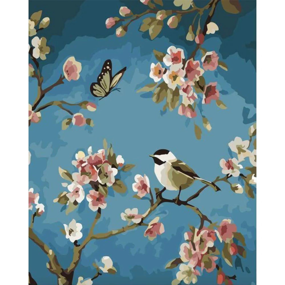 Mariposa y pájaro en rama de flor