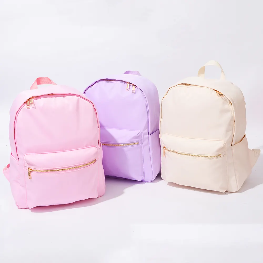 Stock de gran capacidad, bolsa de almacenamiento de viaje con logotipo personalizado DIY, mochila escolar, Color caramelo, nueva mochila de nailon rosa claro