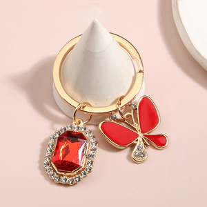 Sevimli kelebek kristal Rhinestone köpüklü kadınlar için çanta anahtarlığı kolye çanta Charm kız Jewel kelebek 3D metal anahtarlık
