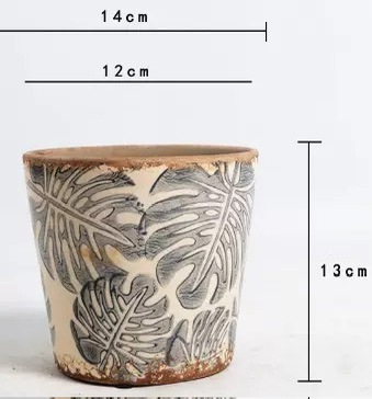 Monstera deliciosa gris - 1413 - con orificios de drenaje en maceta.