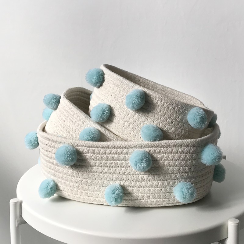 A set of sky-blue balls (one large and two small)