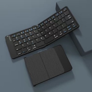Portátil Ultra Slim Seamless Magnetic <span class=keywords><strong>Folding</strong></span> Quiet Keys Blue Tooth teclado sem fio com resistente a riscos Tecido de couro