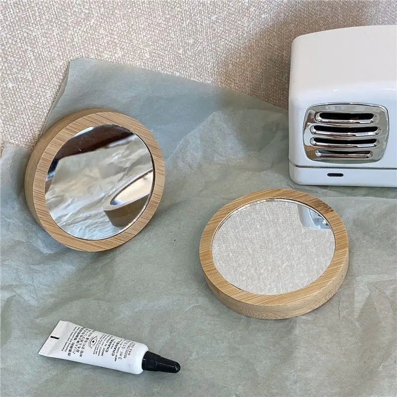 Glühbirne Mini-Makeup-Spiegel weiblicher kleiner runder Hand-Spiegel 2-teiliger Taschenspiegel 2-7 Tage Silber oval kosmetik tragbar hölzern 0,5 USD