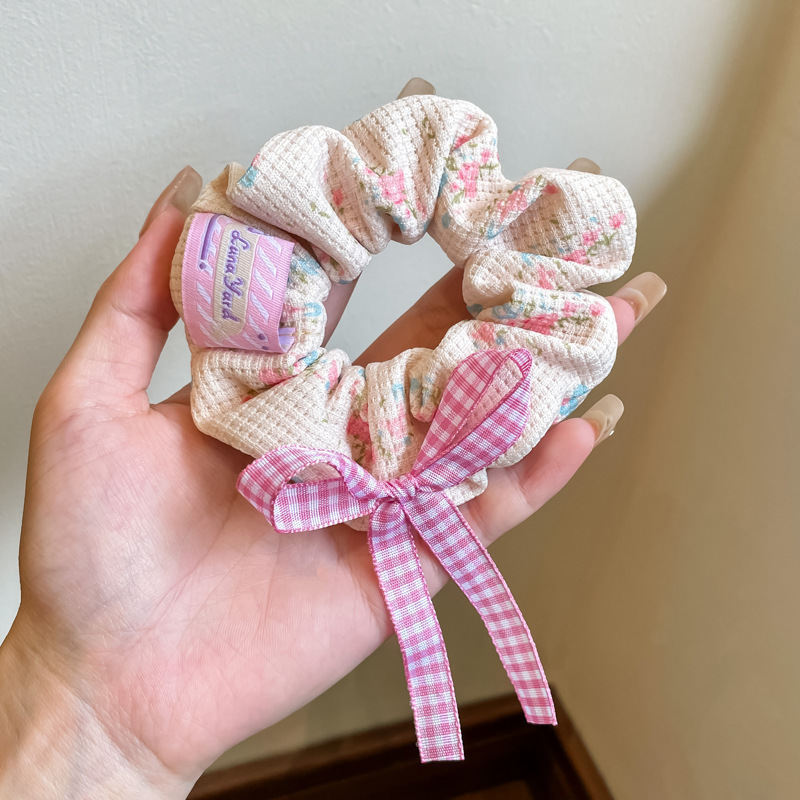 1. White plaid hair tie with pink bow