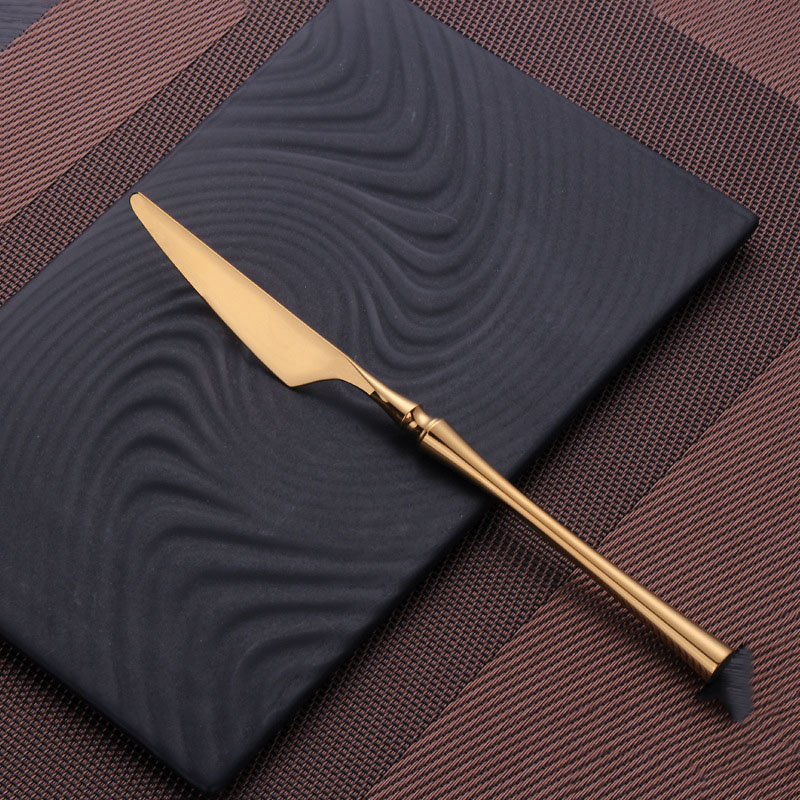 Cuillère à steak dorée