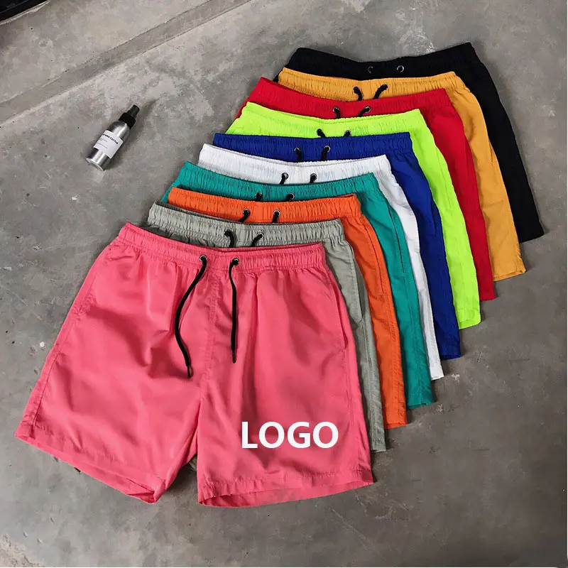 2024 pantalones cortos de secado rápido transpirables con logotipo OEM tamaño grande poliéster OEM logotipo personalizado deportes causal hombres gimnasio pantalones cortos para correr