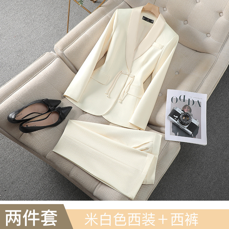 Off-white suit with slightly flared trousers