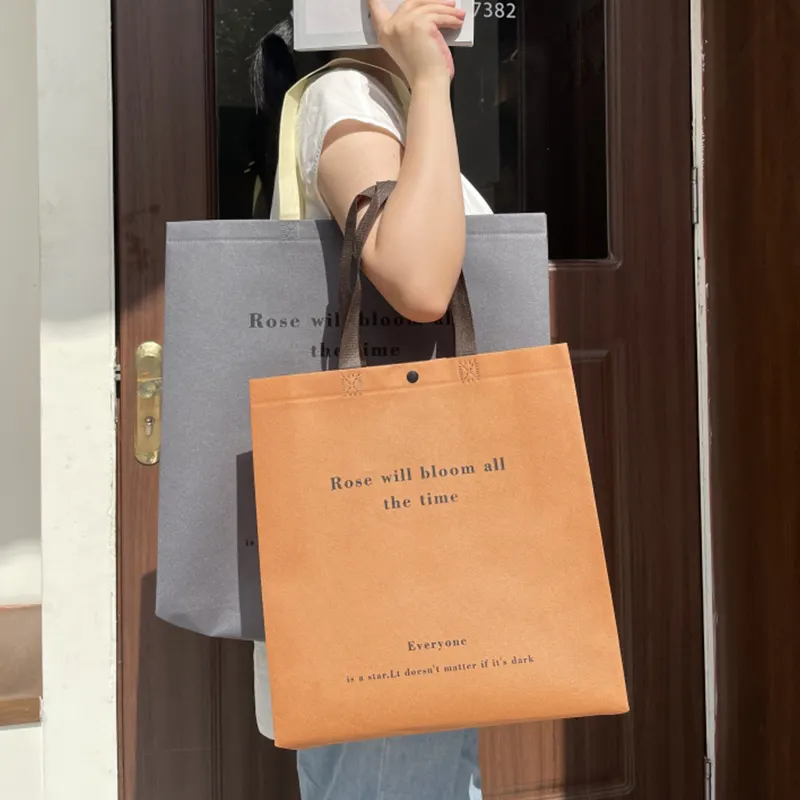 इको कस्टम लोगो मुद्रित पुन: प्रयोज्य अतिरिक्त-चौड़ा गैर बुना कपड़ा टोट बैग किराना खरीदारी के लिए पैकेजिंग उपहार सुरक्षित हैंडल के लिए