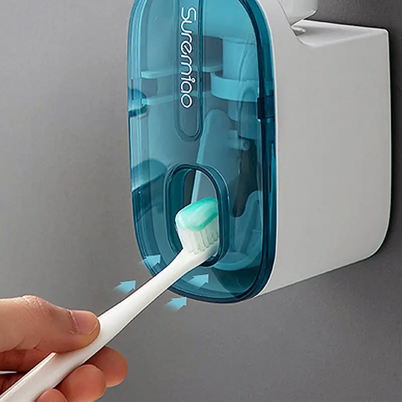 Venta al por mayor exprimidor de pasta de dientes sin agujeros dispensador automático de pasta de dientes montado en la pared del hogar estante de baño artefacto Perezoso
