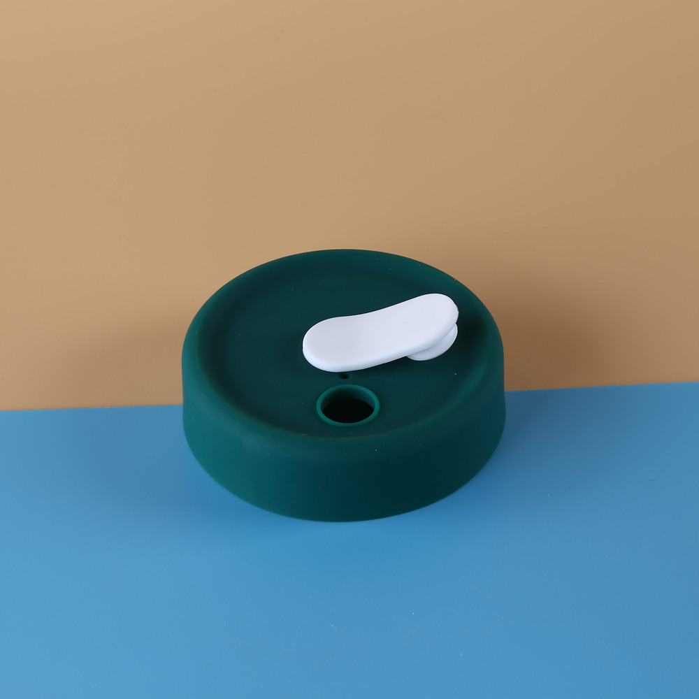 Couvercle vert - bouchon blanc