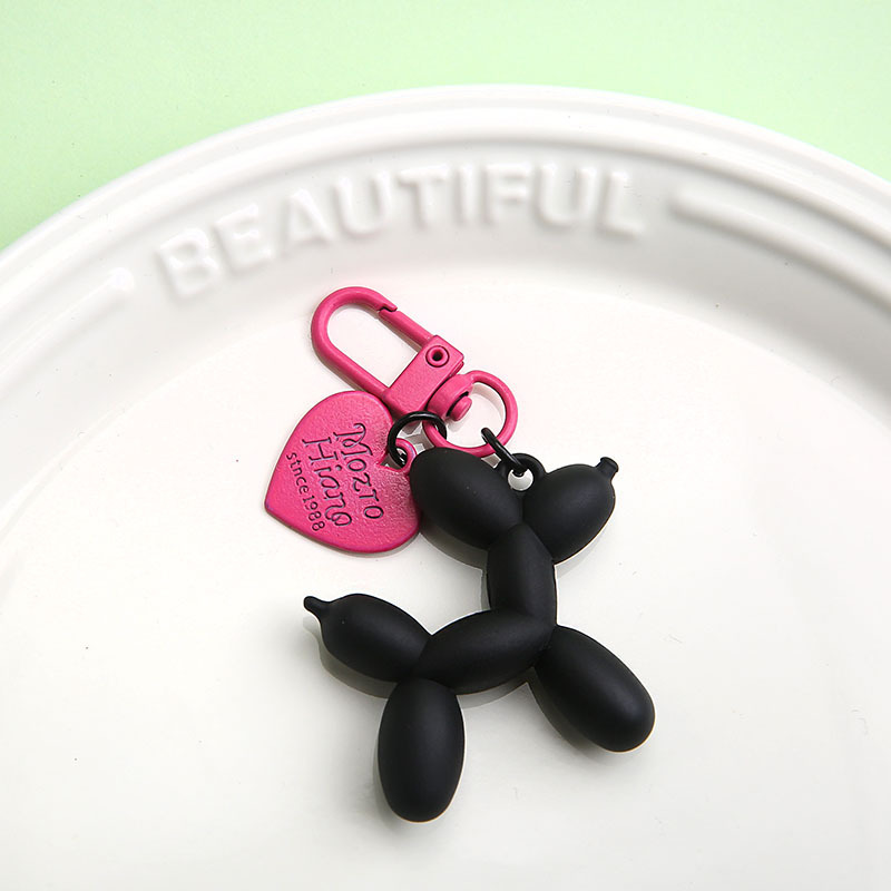 Chiot noir mat + coeur rose rouge