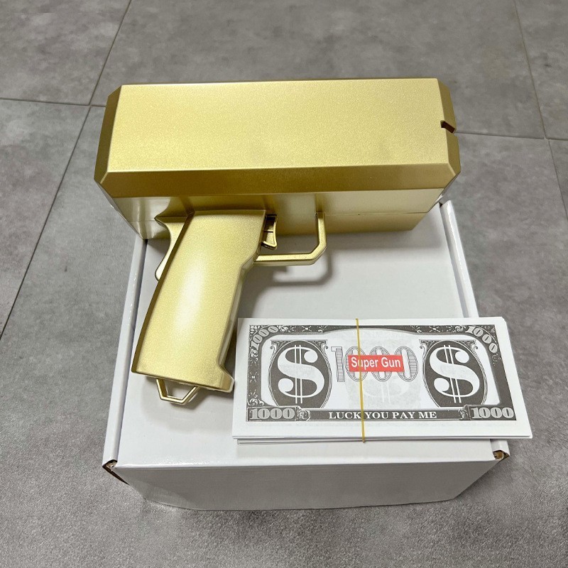 Pintura pistola de oro + 100 hojas de dinero