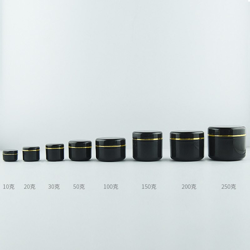 black jar with silver gold rim lid