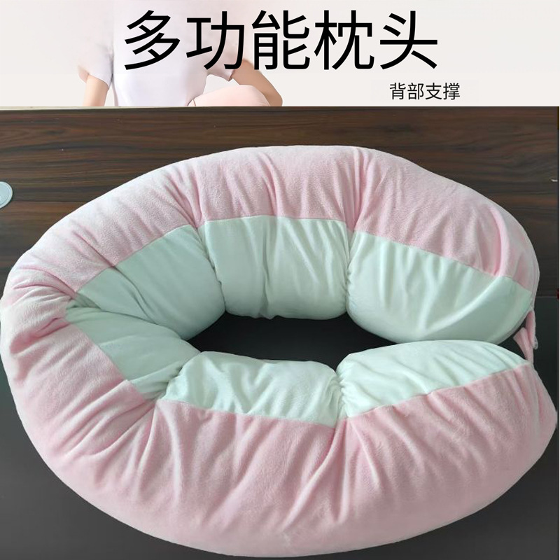 Pea-shaped throw pillow in pink and white