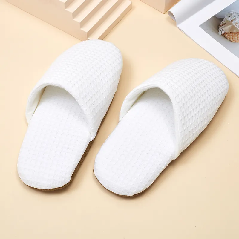 Zapatilla de hotel desechable personalizada de lujo lavable personalizada de gofres blancos de fábrica de China