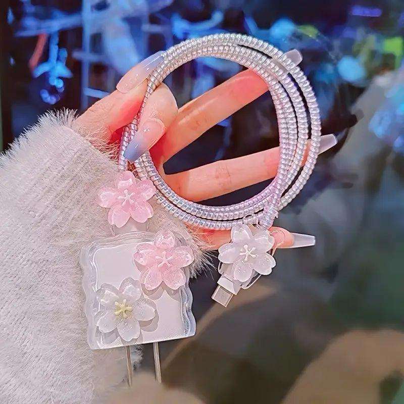 Ensemble de quatre pièces rose avec deux fleurs de pêcher 3D.