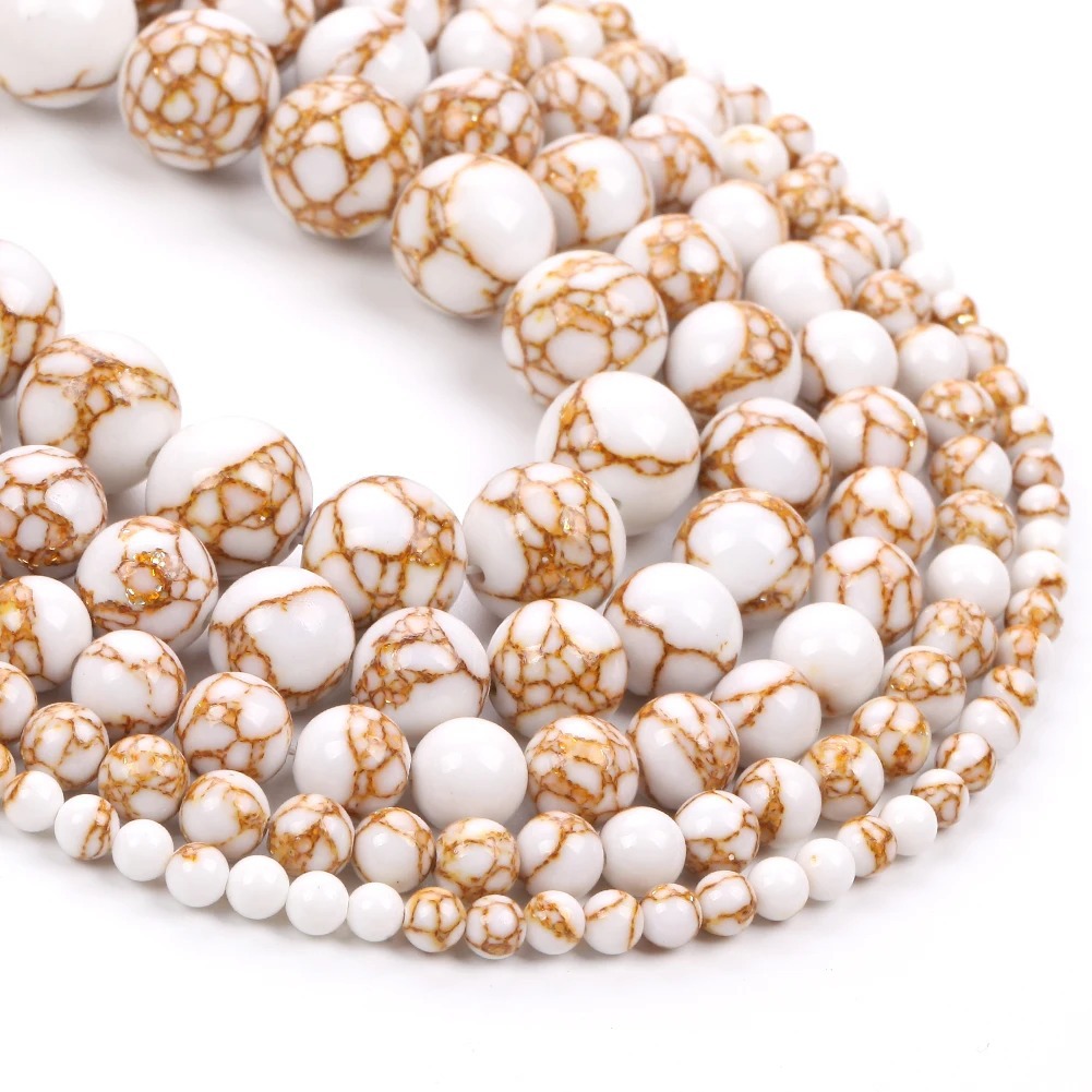 Pin synthétique en or blanc