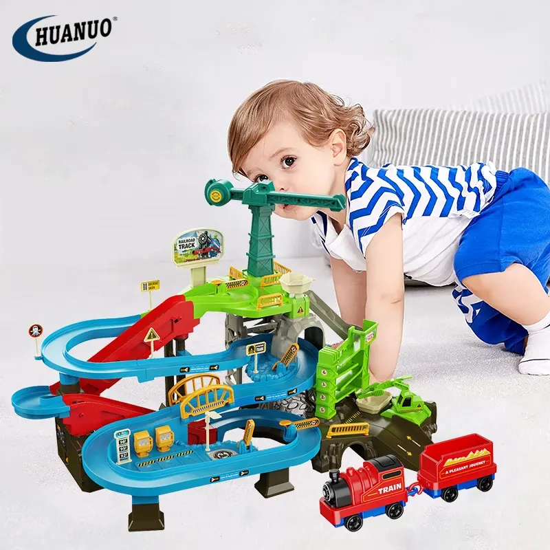 Bambini educativi treno elettrico pista Base avventura giocattoli parcheggio Slot per auto Set di giocattoli con luce musicale per ragazzi