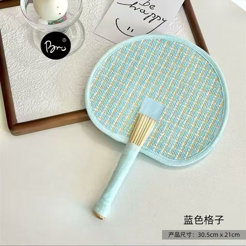 Blue woven palm leaf fan