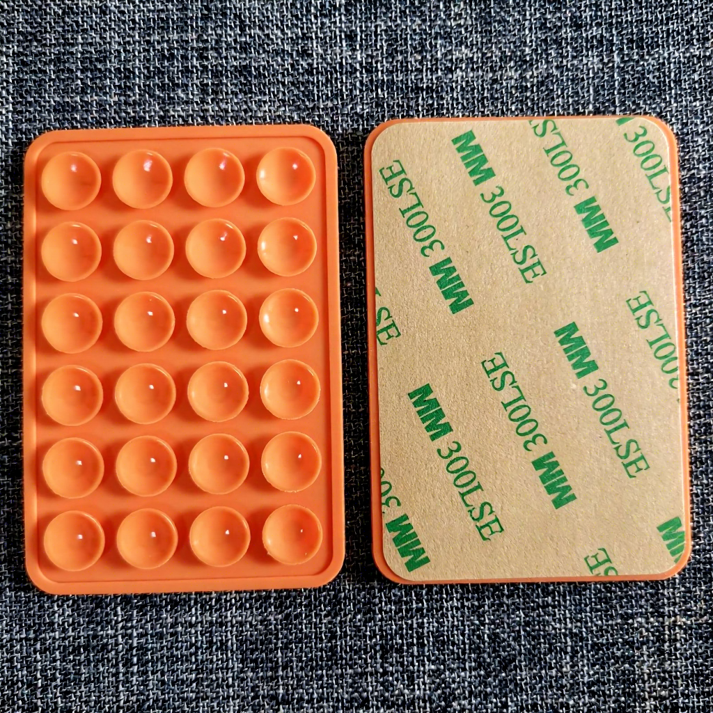 Orange with adhesive-thickened 24-grain square suction cup