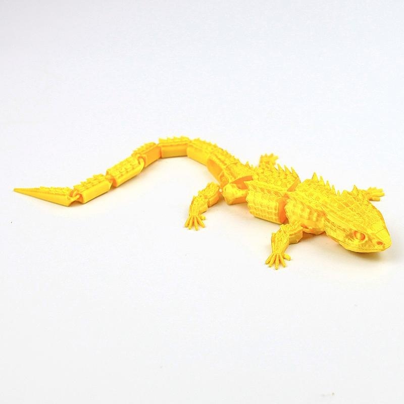 Lagarto dorado de 22,5 cm.