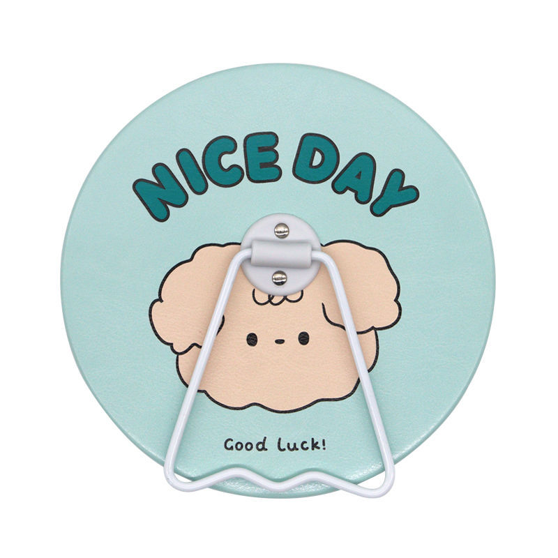 round mirror-light blue curly-coated dog