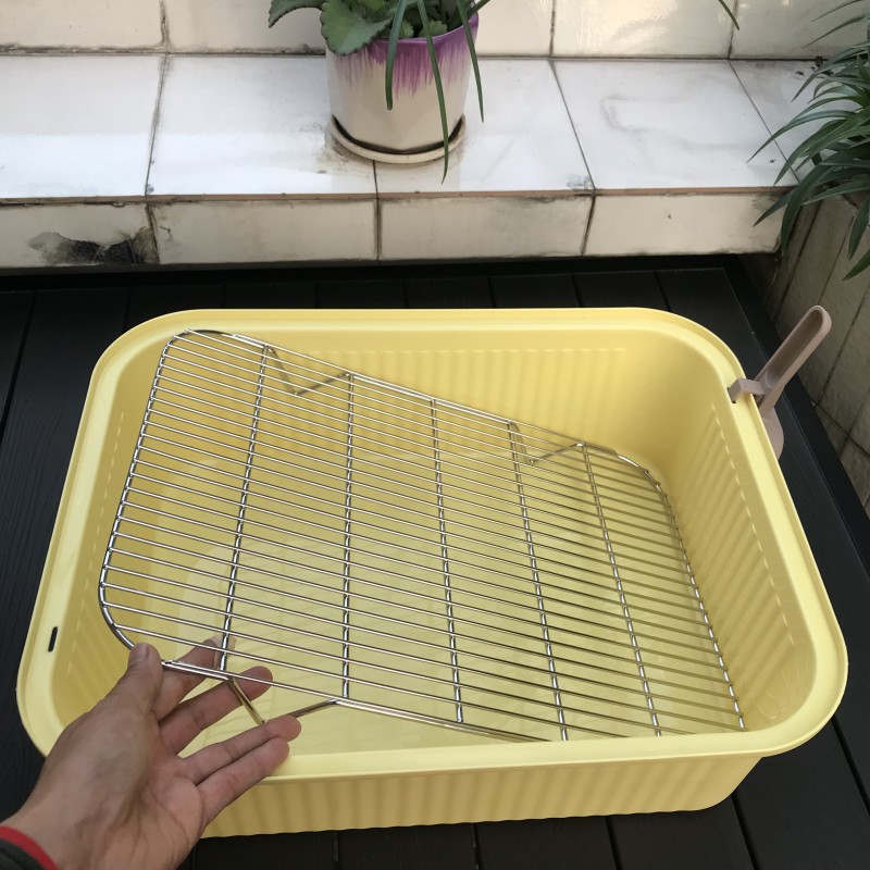 Malla de acero inoxidable para lavabo inferior amarillo.