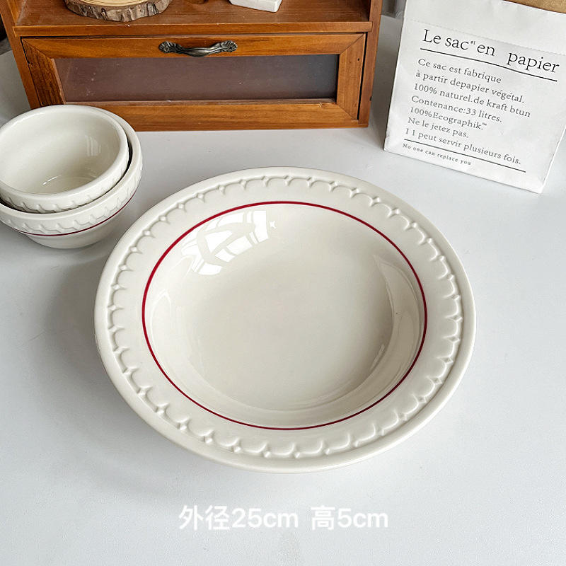 A 9.8-inch soup plate with red line relief
