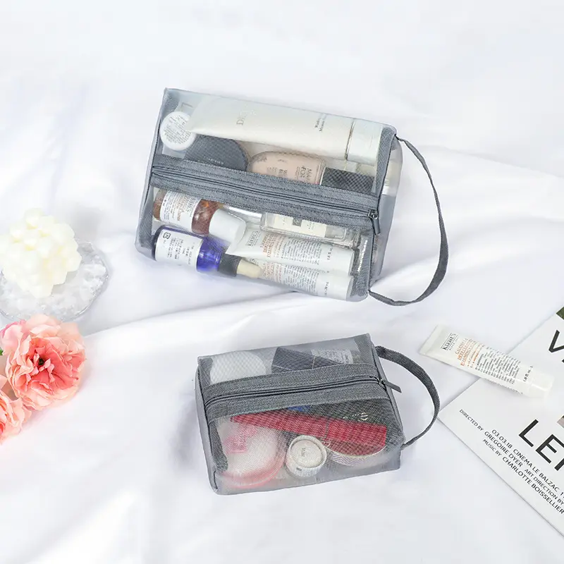 Vente en gros de pochettes de maquillage de voyage en maille de nylon transparentes avec logo personnalisé sac cosmétique recyclable à fermeture éclair