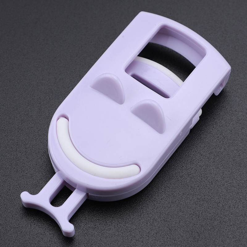 Purple smiley eyelash curler