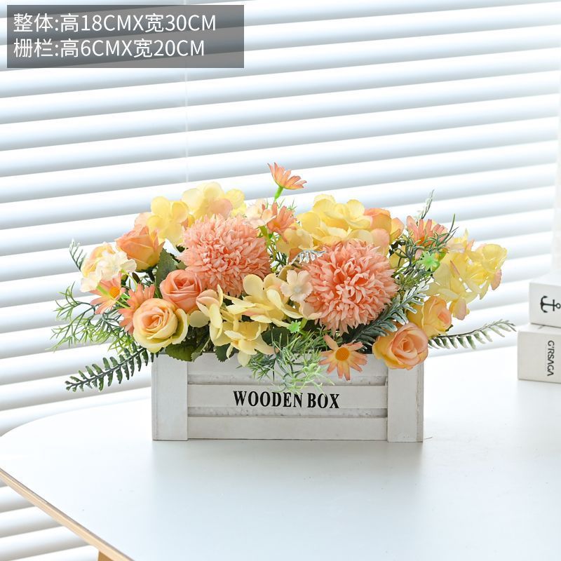 Clôture en bois blanc avec roses et oranges
