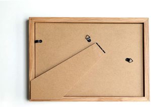 DIYプロジェクト用にペイントする準備ができている未完成の無垢材の写真額縁