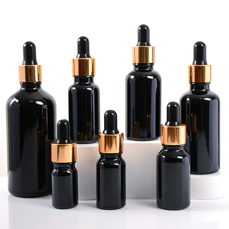 Vacío 5ml 10ml 15ml 20ml 30ml 50ml 100mL Botella cuentagotas negra Botella de aceite esencial ámbar con tapa cuentagotas dorada