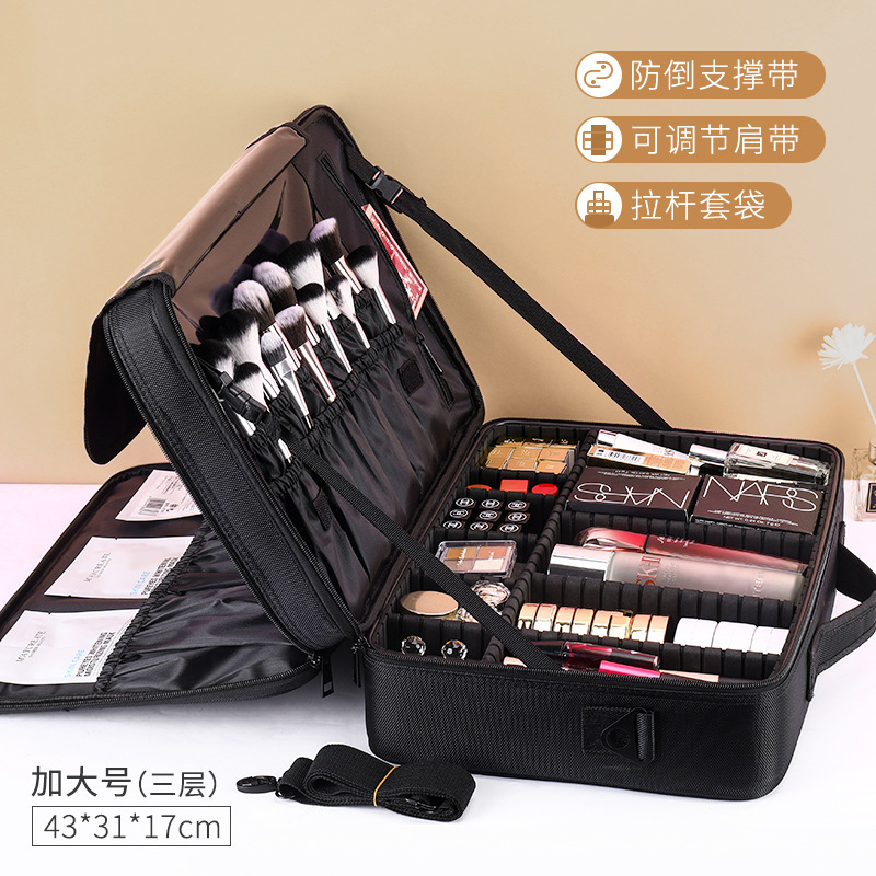 Valise trolley extra large noire à 3 compartiments avec bandoulière.