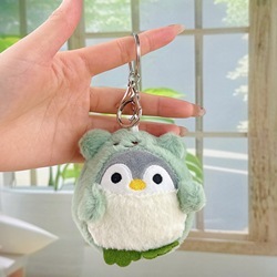 Pingouin travesti vert + boucle argentée