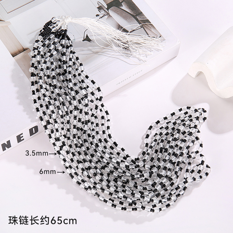8 perles noires rondes transparentes