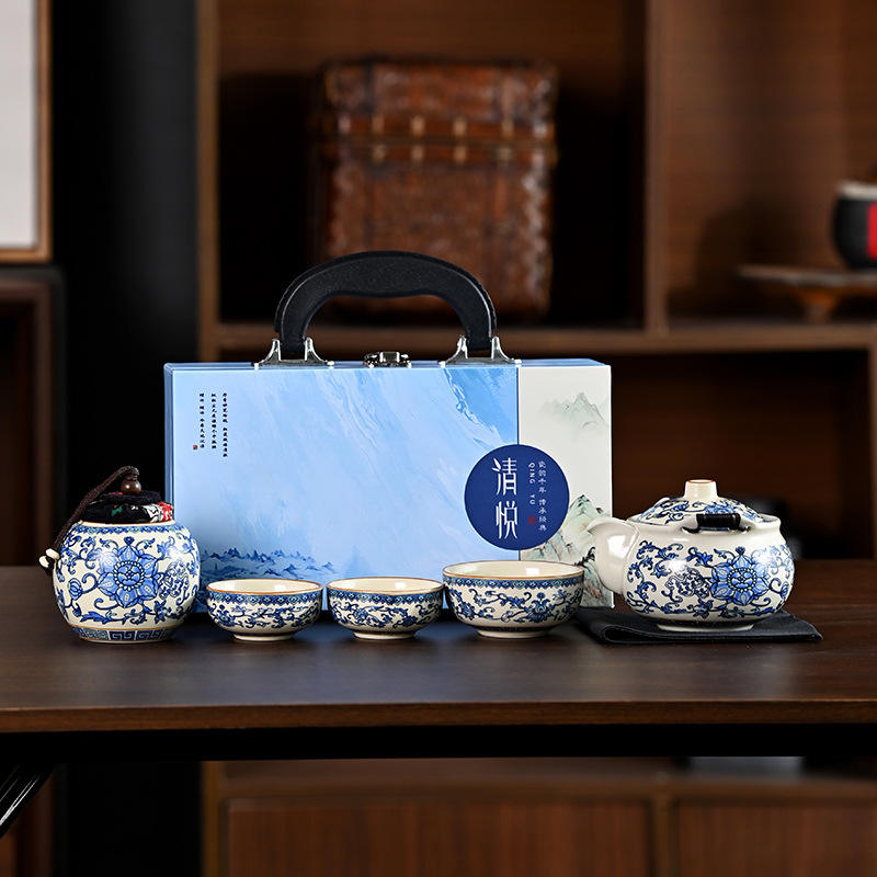 Tetera de mano con diseño de pergamino de loto y una agradable caja de madera.