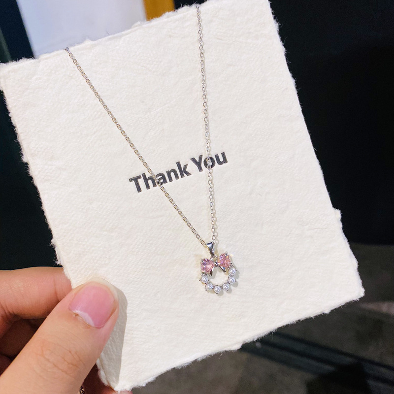 D12 silver pink diamond pearl circle bow