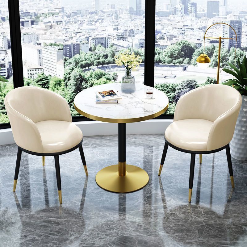 White leather chair imitation stone round table