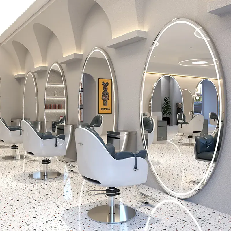 La station de miroir de coiffure ovale moderne la plus vendue a des options de couleur plaquées or et argentées de lampe de LED pour le salon de barbier