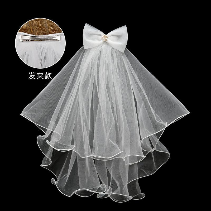 Voile à nœud papillon et fleurs de perles