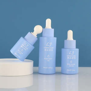 Cilt bakımı mat mavi cam şişe ambalaj takım <span class=keywords><strong>30g</strong></span> krem kavanoz 1oz cam serum damlalıklı şişe püskürtücü kap losyon pompa şişesi