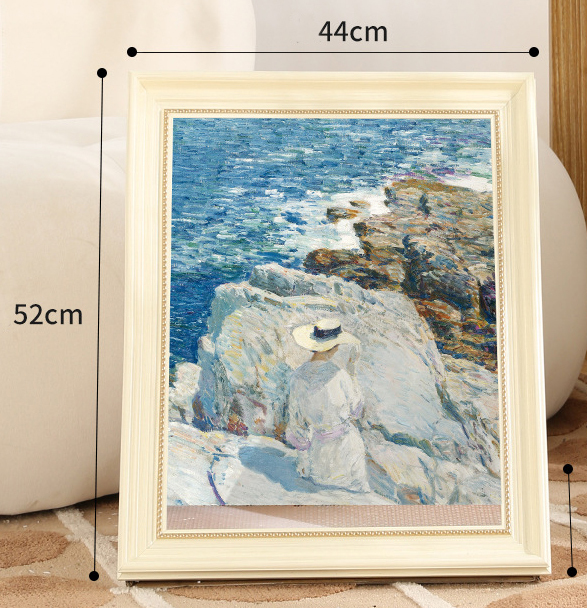 Roches au bord de la mer + cadre blanc