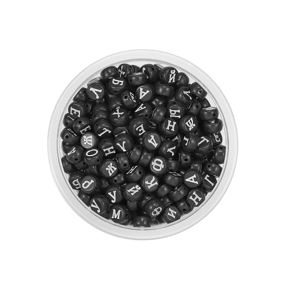 Perle ronde noire et blanche, effet "peau de pêche".