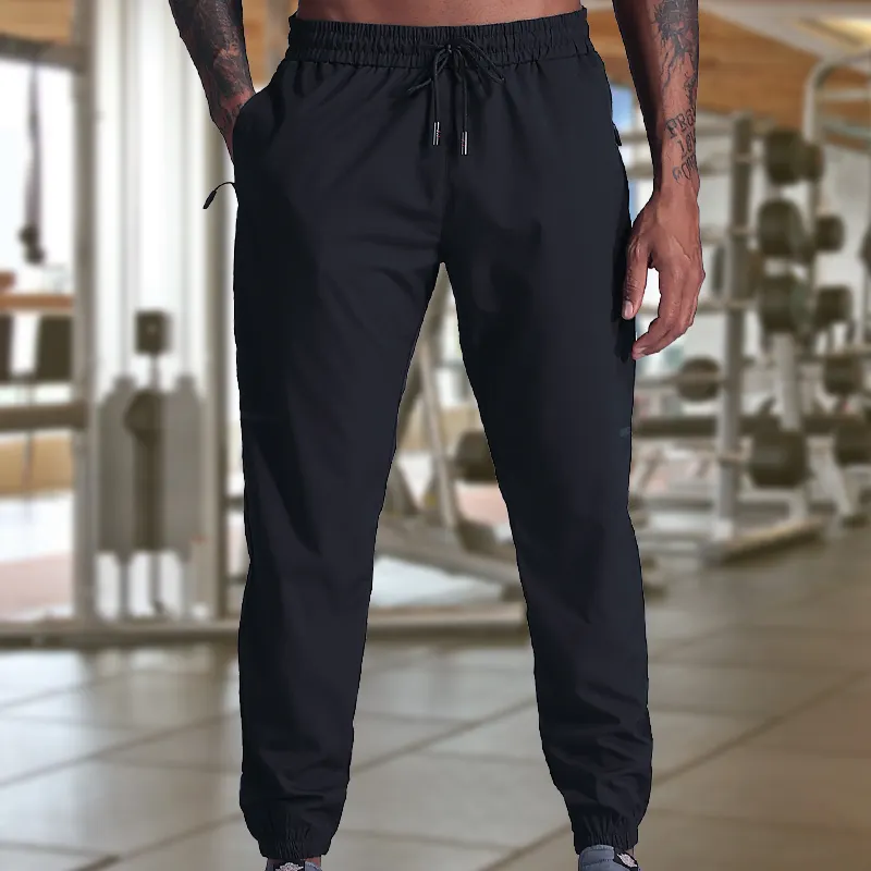 Homens Sportswear Casual Jogger Pants Respirável Track Pants Homens Slim Fit Sweatpants Gym Fitness Poliéster Leve Impresso