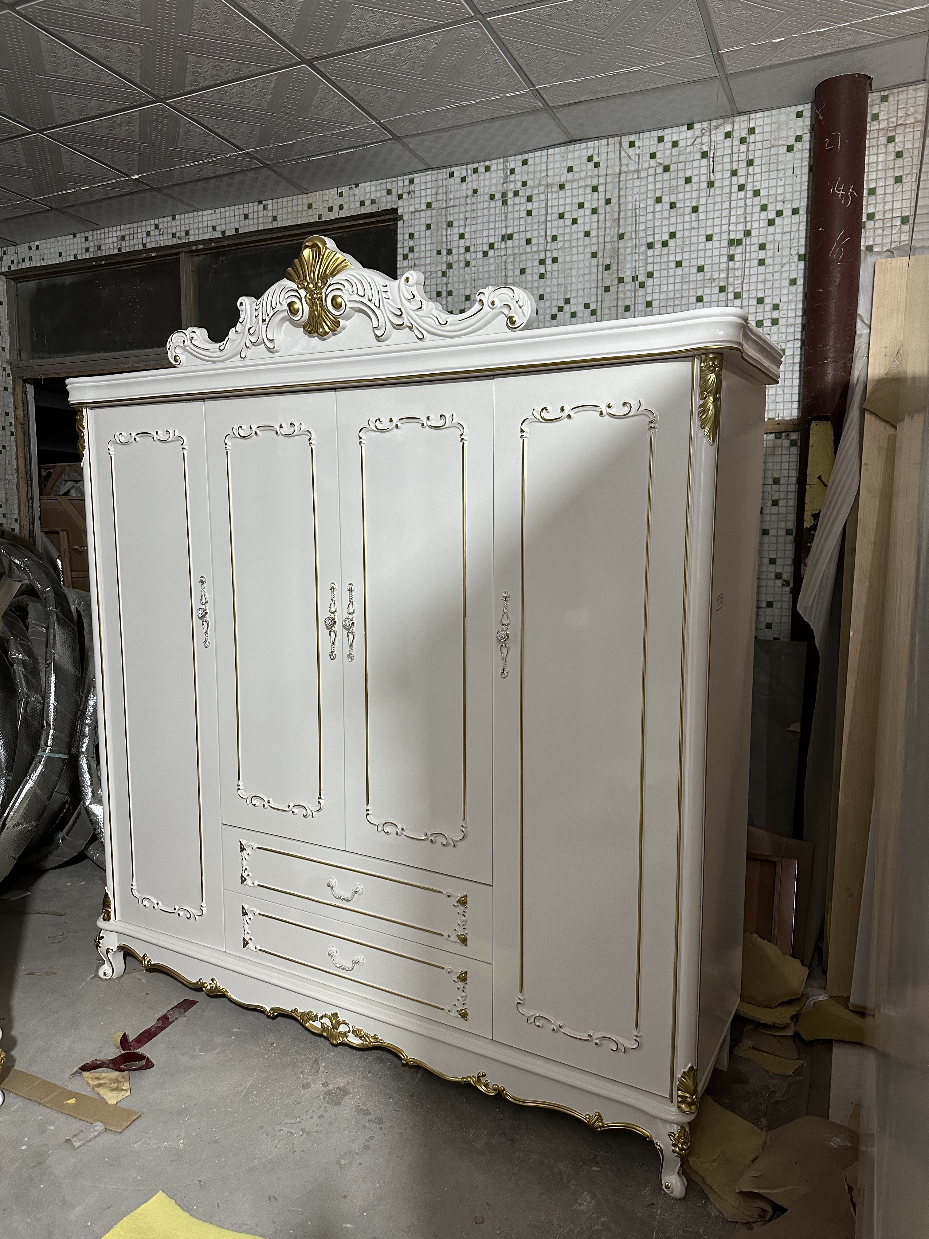 White wardrobe with four doors.